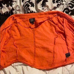 A orange cardigan